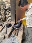 Our guide Percy roasting coffee.